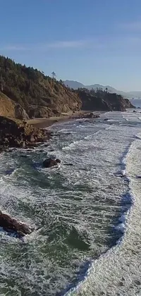 This phone live wallpaper showcases a breathtaking view of a water body adjacent to a cliff, captured by drone footage in Oregon