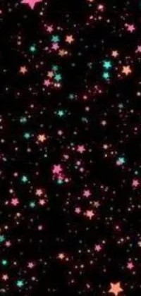 This captivating phone live wallpaper features a black background adorned with pink and green stars, giving it a Tumblr-inspired feel