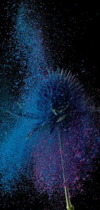 This phone live wallpaper features a mesmerizing flower sprinkled with blue and pink powder