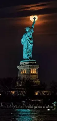 This stunning live wallpaper features the magnificent Statue of Liberty illuminated by the shimmering lights of the city at night