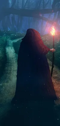 This phone live wallpaper features a digital art scene depicting a mysterious figure holding a candle while walking down a dark path in a forbidden forest