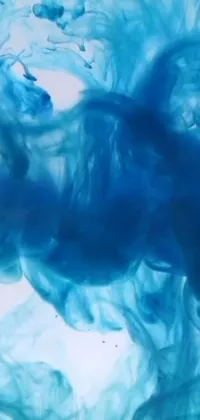 Our phone live wallpaper features a stunning close-up of a deep blue substance floating and swirling in water