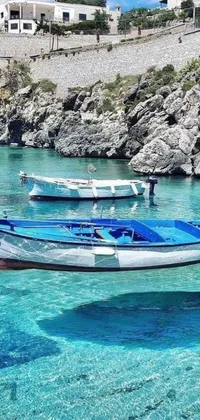 This live wallpaper features tranquil boats floating on crystal clear blue waters