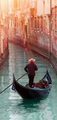 This stunning live phone wallpaper captures a man in a gondola as he quietly glides through a peaceful canal