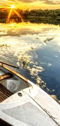 This live wallpaper captures a picturesque scene of a boat sailing in a body of water