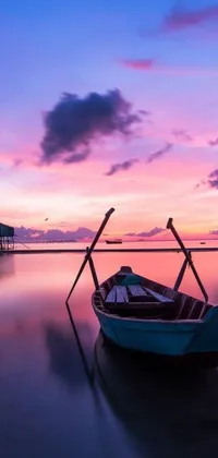 Looking for a stunning wallpaper that will bring peace and serenity to your phone screen? Check out this beautiful live wallpaper featuring a small boat floating on peaceful waters against a picturesque background