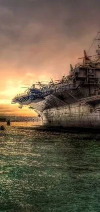 This phone live wallpaper depicts a gorgeous scene of an aircraft carrier ship on blue waters
