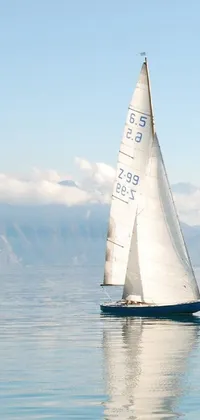 This phone live wallpaper showcases a serene and minimalist scene of a sailboat on calm waters