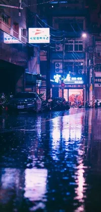 Rev up your phone with a cool live wallpaper that features a motorcyclist navigating a rainy urban street