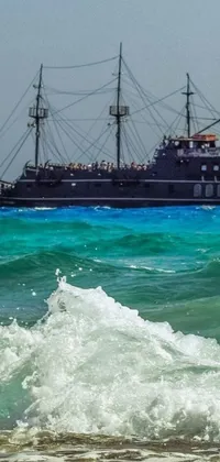 This live wallpaper for your phone showcases a captivating scene of a man surfing a giant wave and an enormous pirate ship sailing in the distance