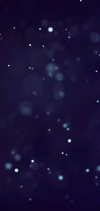 This snowboarding-themed live wallpaper features a daring snowboarder performing airborne stunts while surrounded by dark blue spheres and sparkling glitter GIFs