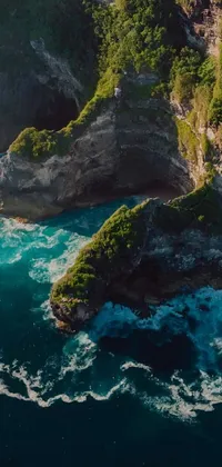 This live wallpaper features a stunning landscape of a vast body of water and lush green hillside captured by a 4k drone photographer