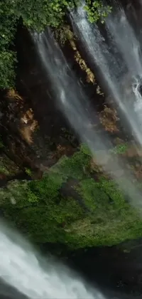 Enjoy the serene beauty of nature right on your phone with this dazzling waterfall live wallpaper