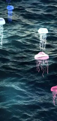 This live wallpaper showcases a digital rendering of a group of jellyfish floating gracefully on top of a body of water