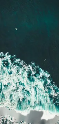 Get lost in the essence of surfing with this phone live wallpaper! You'll be mesmerized by the beautiful deep azure tones of the ocean contrasted against the bright white of the giant wave as a group of surfers ride their surfboards with remarkable balance and skill