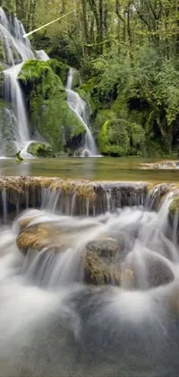 Experience nature's beauty on your phone's screen with an exquisitely captured live wallpaper of a waterfall in a forest setting
