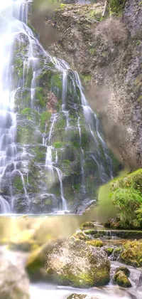 Get lost in the serenity of a cascading waterfall with this stunning phone live wallpaper
