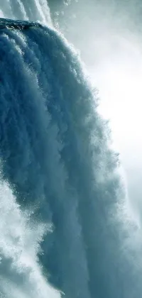 This striking phone live wallpaper captures the excitement of surfing in front of a majestic, rushing waterfall
