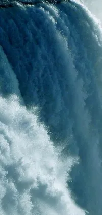 Enhance the look of your phone screen with this mesmerizing live wallpaper of a surfer riding the waves in front of a magnificent waterfall