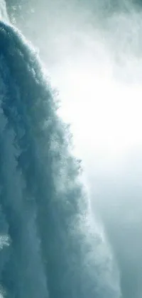 This live wallpaper depicts a surfer on a board in front of a waterfall
