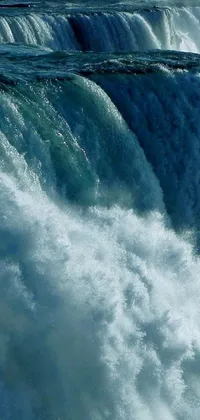 This dynamic live wallpaper features a thrilling image of a surfer riding the soaring waves atop a cascading waterfall