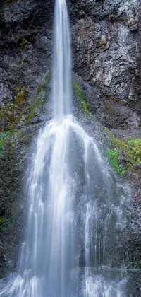 This phone live wallpaper captures the beauty of a cascading waterfall in closeup view