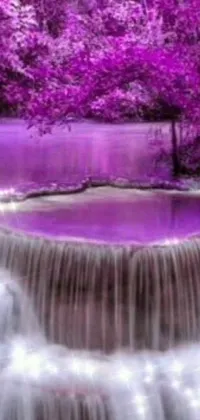 Looking for a stunning live wallpaper for your phone? Look no further! This wallpaper features a breathtaking waterfall nestled in the heart of a vibrant, purple forest