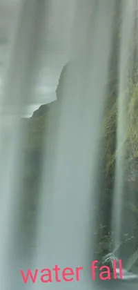 This phone live wallpaper depicts a serene waterfall with the words "water fall" superimposed