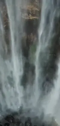 This stunning phone live wallpaper features a breathtaking waterfall that captures the soothing and invigorating essence of nature