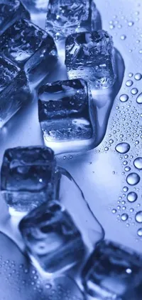This live wallpaper showcases a close-up photograph of a bunch of clear ice cubes resting on a table