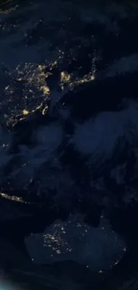This live phone wallpaper is a breathtaking display of the earth at night seen through satellite view