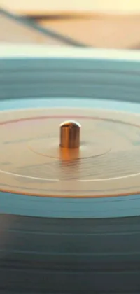 This live wallpaper showcases a vinyl record in close-up, with superb kinetic art and Wes Anderson-inspired visuals