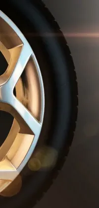 This phone live wallpaper showcases a close up of a realistic and detailed tire on a car