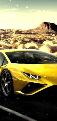 Looking for an exciting live wallpaper for your phone? Check out this stunning image of a sleek, yellow Lamborghini driving down a desert road