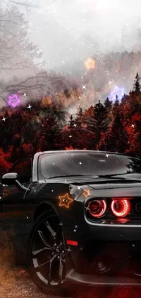 Get ready to enhance the look of your phone with this lively wallpaper! Featuring a black sports car parked in front of a tranquil forest, this wallpaper is created in soft red and brown color tones using a technique called soft color dodge