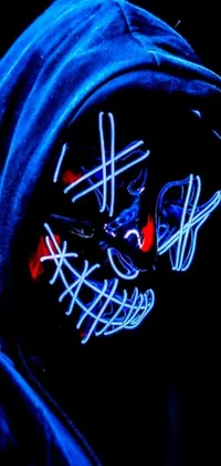 Get edgy with this live wallpaper featuring a close-up of a person wearing a hoodie, against a backdrop of neon wires and blue faces