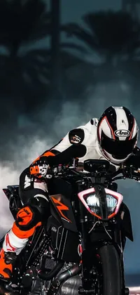 This incredible live phone wallpaper showcases a thrilling motorcycle ride at night