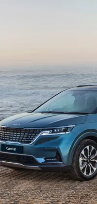 This live wallpaper for your phone features a blue SUV parked in front of a serene ocean, with a canoe nearby