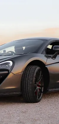 This live wallpaper showcases a stunning silver sports car parked on a roadside