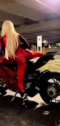 Introducing an electrifying phone live wallpaper featuring a woman riding a Ducati Panigale motorbike in a garage