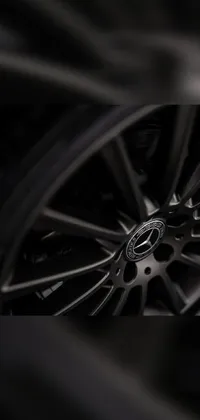 Get an exclusive, all-black matte Mercedes wheel close-up shot for your phone live wallpaper