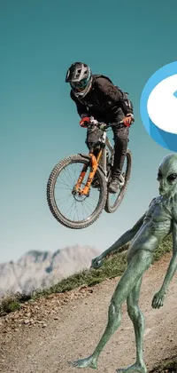 This phone live wallpaper is a surreal piece of art featuring a man on a bike soaring through the air in front of a mountainous and alien backdrop