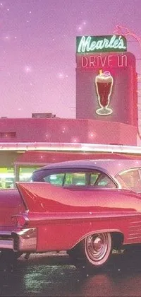 This live phone wallpaper features a retro-inspired scene with a red car parked in front of a classic diner