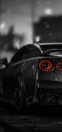This vertical phone live wallpaper features a captivating black and white photograph of the Nissan GTR R 3 4 sports car in a trendy cyberpunk art style
