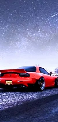Looking for an adrenaline-pumping live wallpaper for your phone? Check out this stunning digital rendering of a red sports car racing down a snowy road