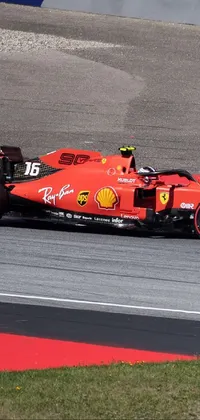 This live <a href="/">phone wallpaper</a> showcases a red race car speeding down a track