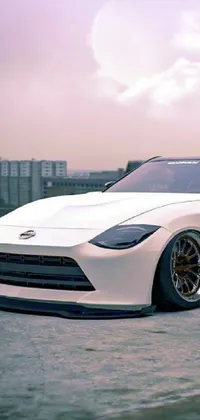 This live wallpaper features a stunning white sports car parked in an empty lot