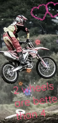 Looking for an action-packed live wallpaper for your phone? Check out this vibrant pop art image of a man jumping a dirt bike in midair! The detailed wheels and colorful design make it the perfect choice for anyone who loves off-road riding