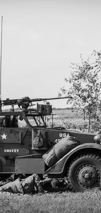 Looking for a stunning live wallpaper for your phone? Check out this black and white photograph of a military vehicle in the figuration libre style