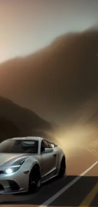 This live wallpaper for your phone showcases a silver sports car speeding down a winding road